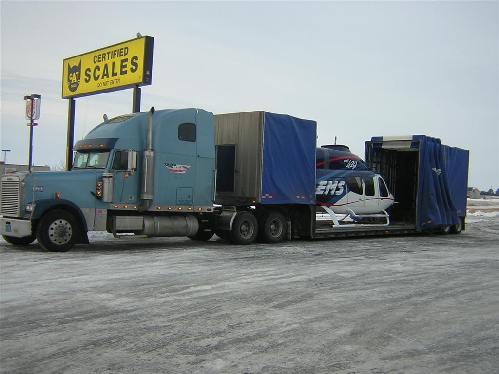 Our double drop curtainside trailers have between 30' and 34' in the well...long enough to fit things like a helicopter