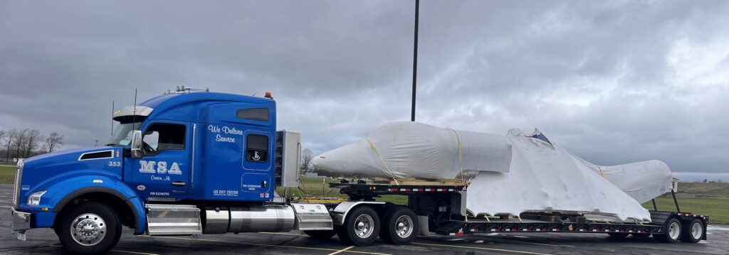 Open double drop trailers can have pieces loaded on all 3 decks